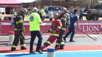 Red Team Firefighter Hauling a Rescue Dummy 1